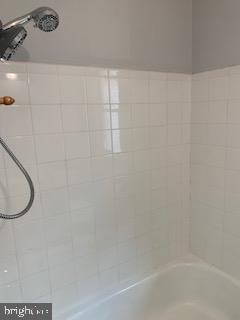 223 Kinsley Road Pemberton, NJ 08068 - Photo 10 of 12 a bathroom with a shower and a bath tub