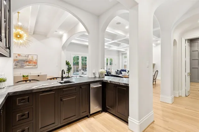 a kitchen with a sink and cabinets
