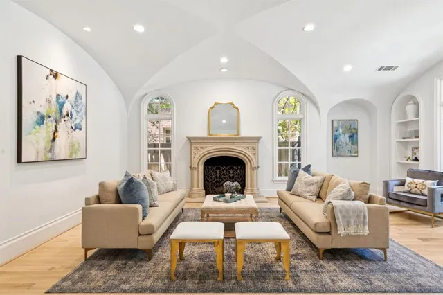 a living room with furniture and a fireplace