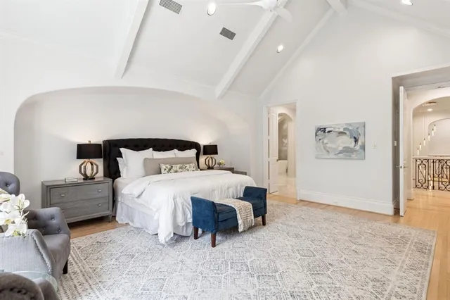 a bedroom with a bed and wall painting