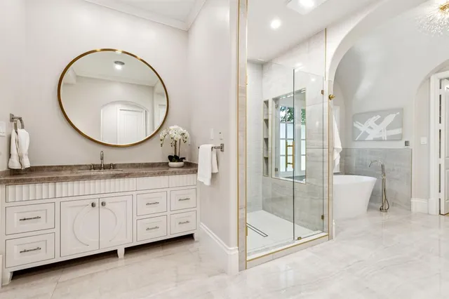 a bathroom with a double vanity sink and a mirror