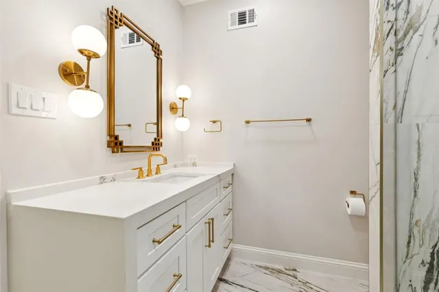a bathroom with a sink and a mirror