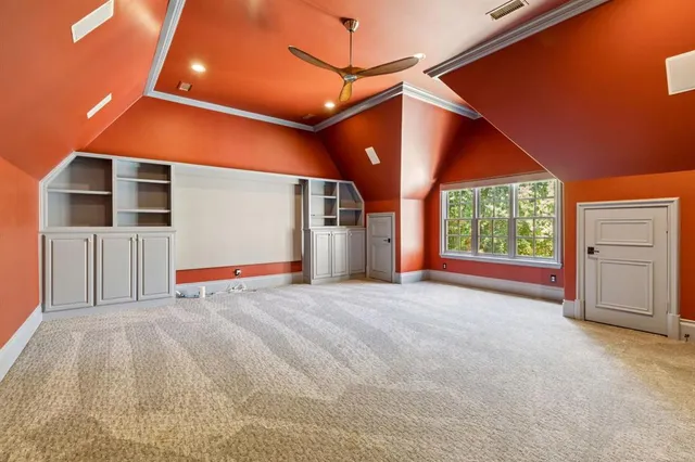 a view of empty room with a ceiling fan