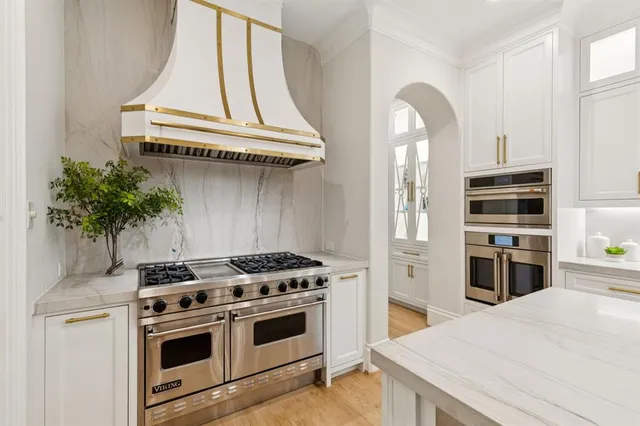 a kitchen with a stove and a microwave