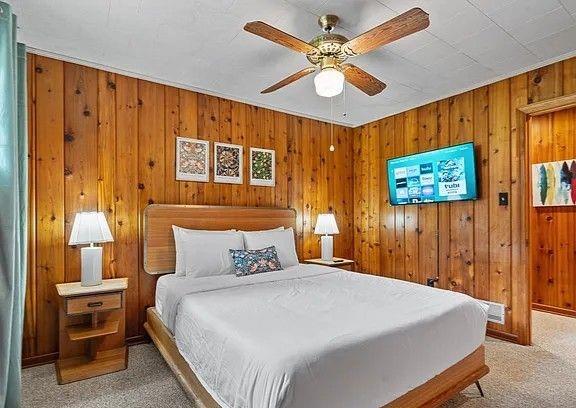 264 Euharlee Road Southwest Cartersville, GA 30120 - Photo 23 of 45 a bedroom with a large bed and a chandelier