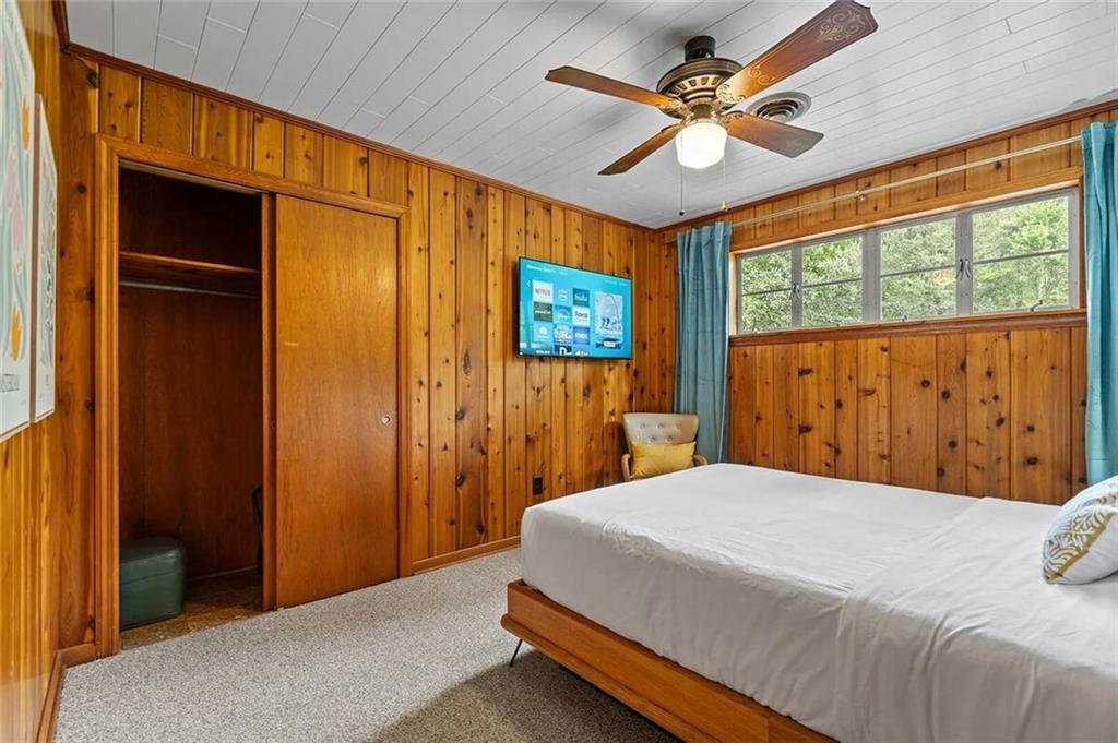 264 Euharlee Road Southwest Cartersville, GA 30120 - Photo 29 of 45 a bedroom with a bed and a large window