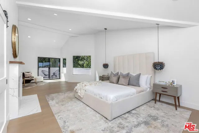 a bedroom with a bed and a couch