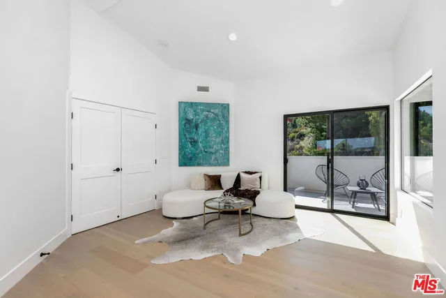 a spacious bathroom with a bathtub sink and mirror
