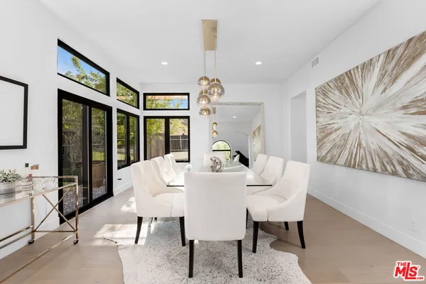 a kitchen with stainless steel appliances a refrigerator sink and microwave