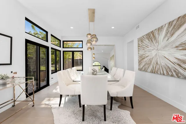 a kitchen with stainless steel appliances a refrigerator sink and microwave