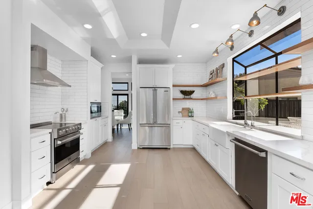 a view of a backyard with sitting area