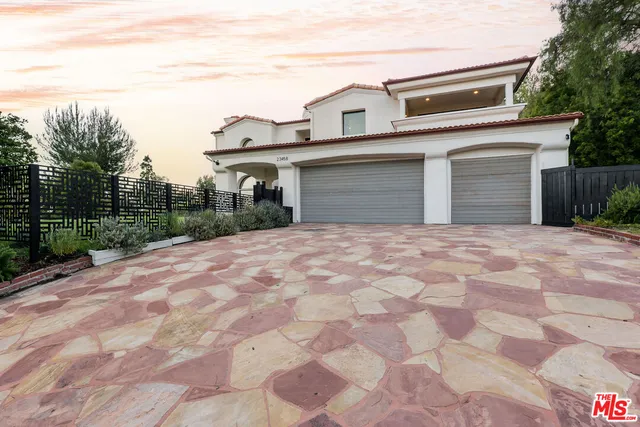 a view of a house with backyard porch and sitting area