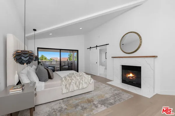 a living room with a couch and a fireplace