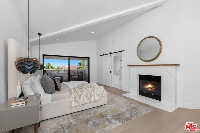 a living room with a couch and a fireplace