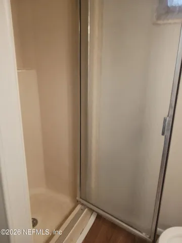 a bathroom with a glass door