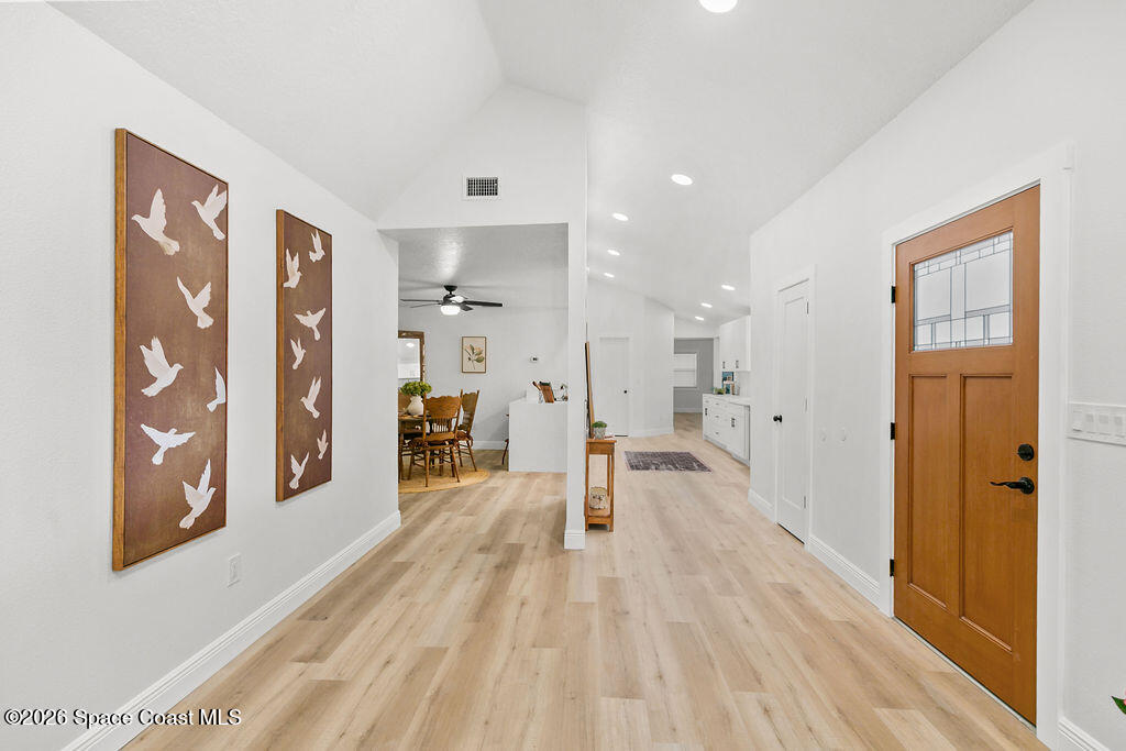 1815 Ford Road Mims, FL 32754 - Photo 2 of 59 a view of a big room with wooden floor and windows