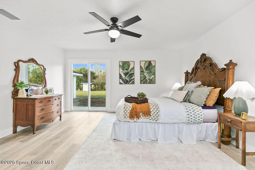 1815 Ford Road Mims, FL 32754 - Photo 23 of 59 a bedroom with furniture and a window