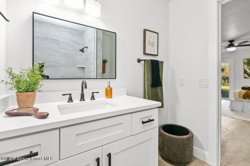 1815 Ford Road Mims, FL 32754 - Photo 24 of 59 a bathroom with a sink and a mirror