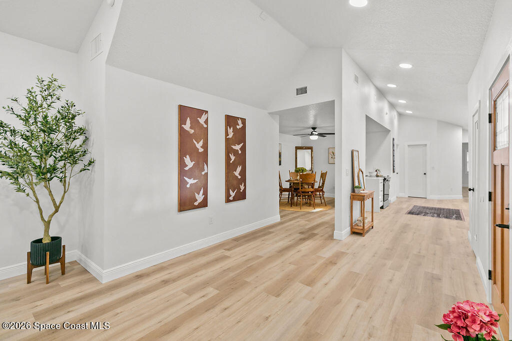 1815 Ford Road Mims, FL 32754 - Photo 3 of 59 a view of a hallway with a living room