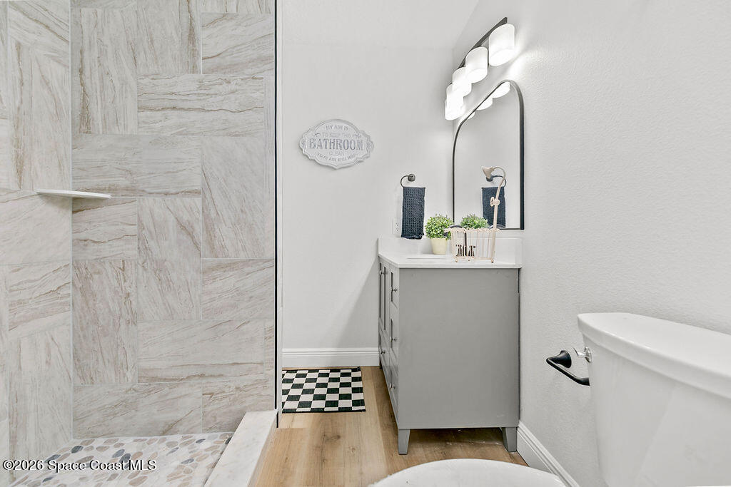 1815 Ford Road Mims, FL 32754 - Photo 32 of 59 a bathroom with a sink a toilet and shower