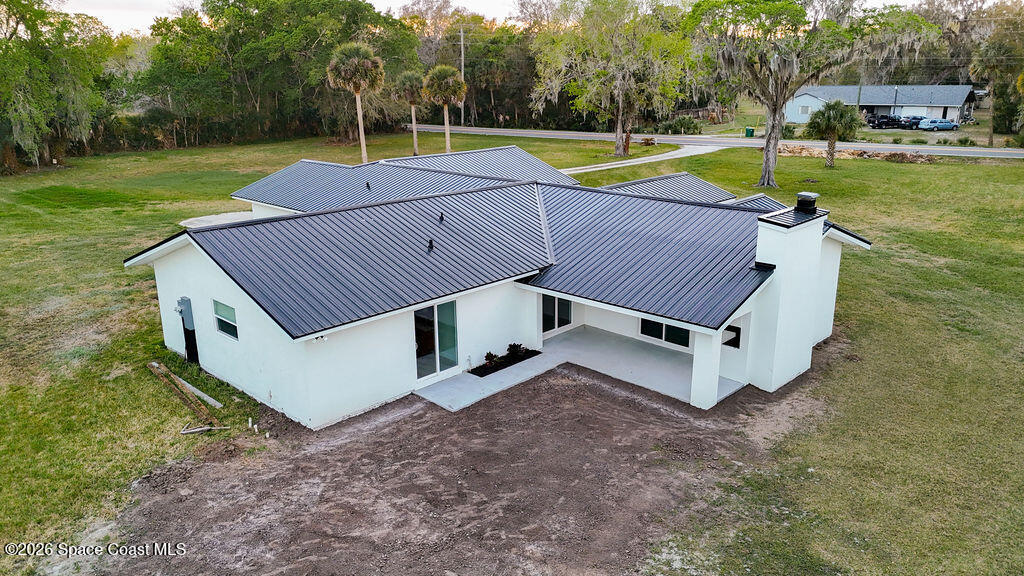 1815 Ford Road Mims, FL 32754 - Photo 47 of 59 an aerial view of a house with swimming pool and a yard