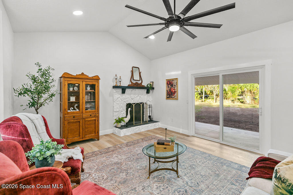 1815 Ford Road Mims, FL 32754 - Photo 7 of 59 a living room with furniture and a flat screen tv