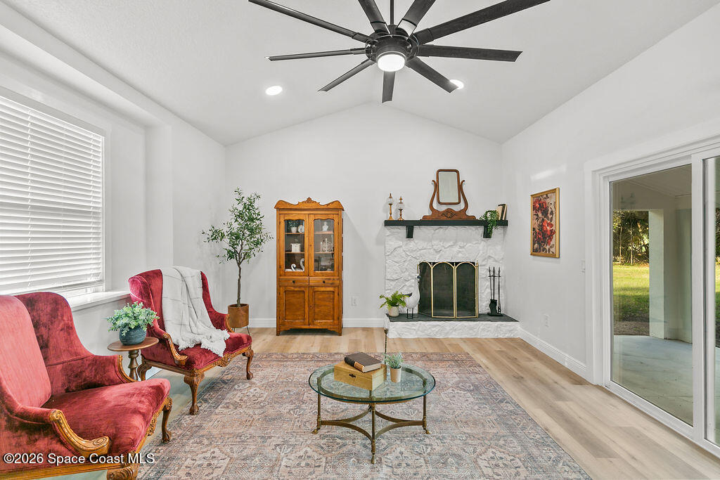 1815 Ford Road Mims, FL 32754 - Photo 8 of 59 a living room with furniture and a fireplace