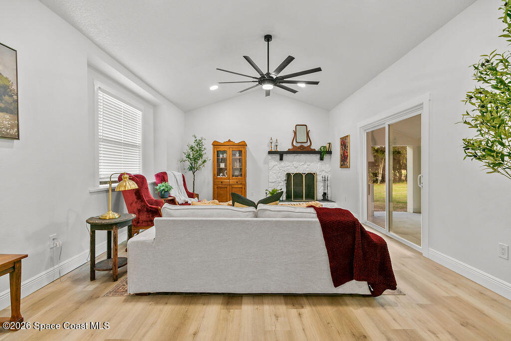 1815 Ford Road Mims, FL 32754 - Photo 10 of 59 a bed room with a bed and a chandelier