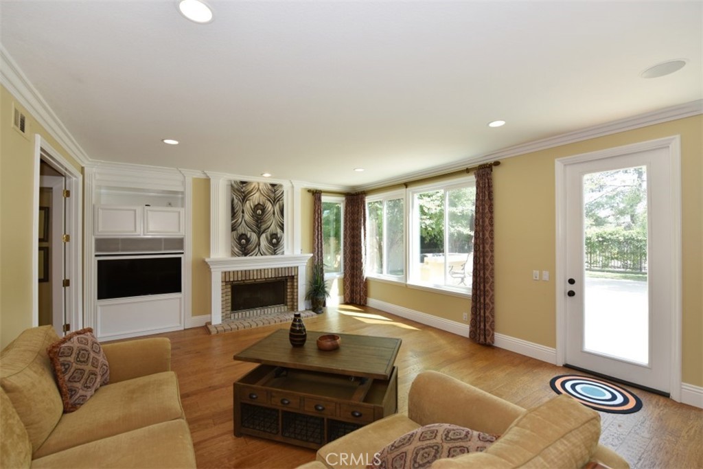 12 Brigadier Irvine, CA 92603 - Photo 27 of 50 a living room with furniture window and a fireplace