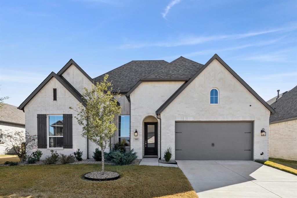 1903 Midhurst Drive Forney, TX 75126 - Photo 3 of 31 a front view of a house with garden