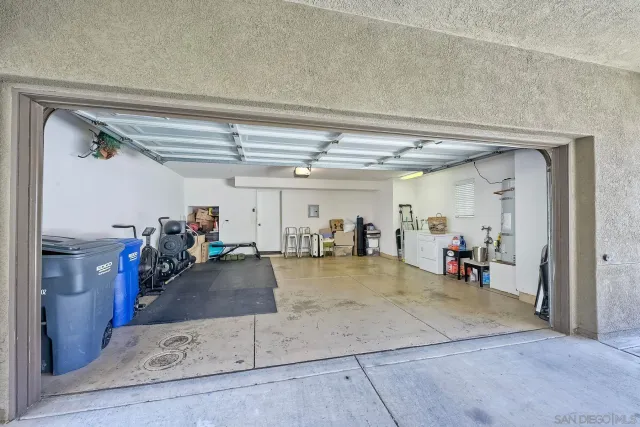 a front view of a house with yard and garage