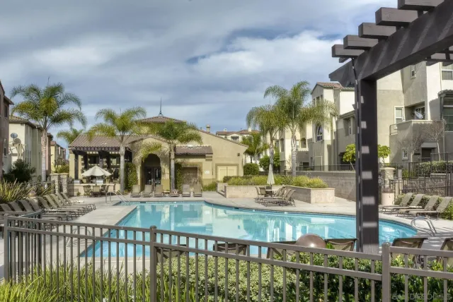 a front view of a house with garden and patio