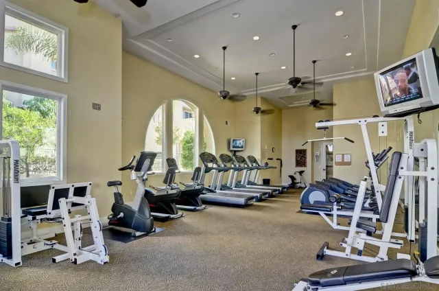 a view of a swimming pool with a patio and a yard