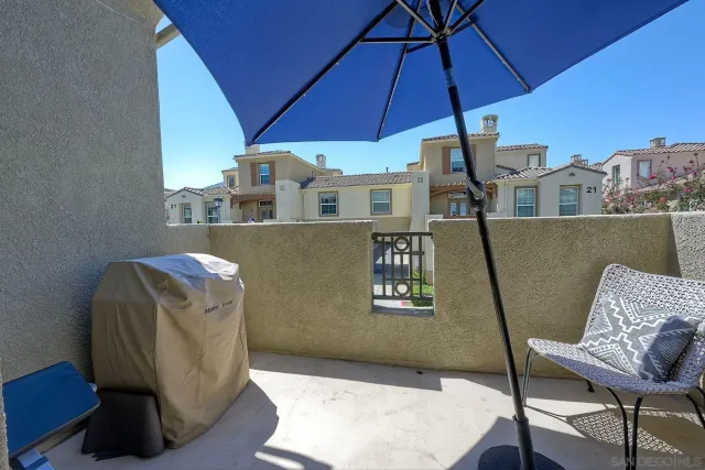 a view of a chair and table in the balcony