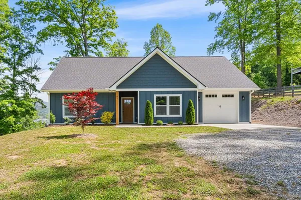 a house with trees in the background