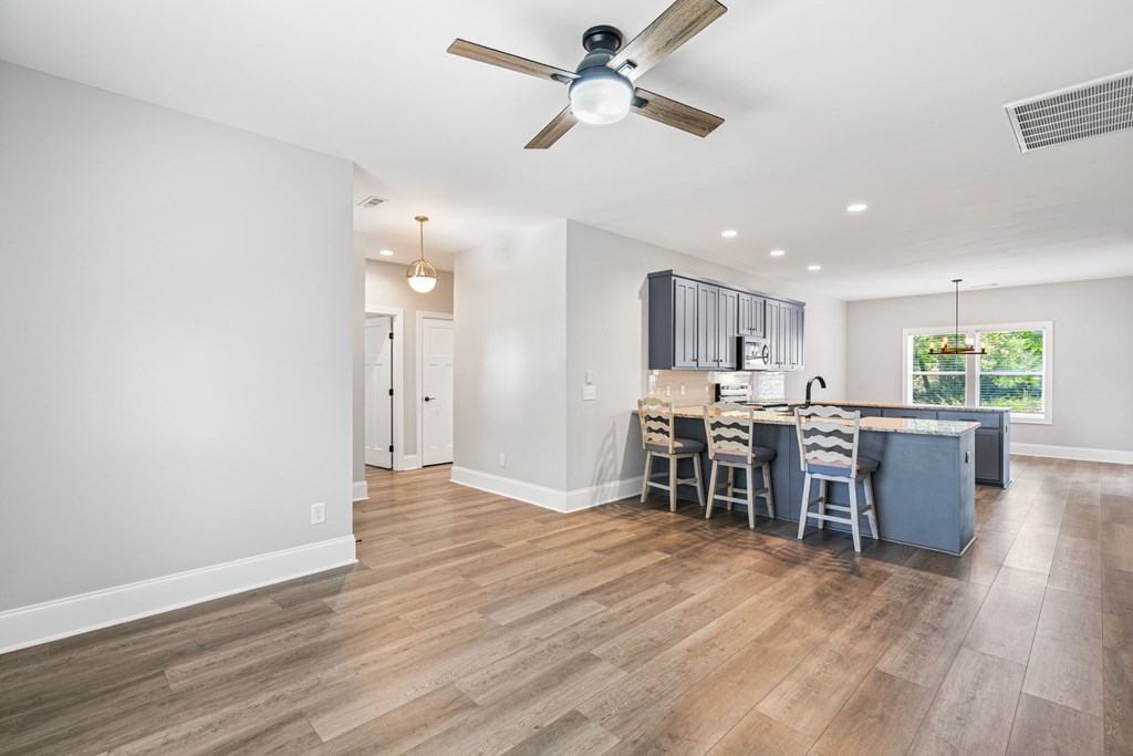 91 Dewey Ridge Lane Hayesville, NC 28904 - Photo 27 of 40 a view of a kitchen with dining room and wooden floor