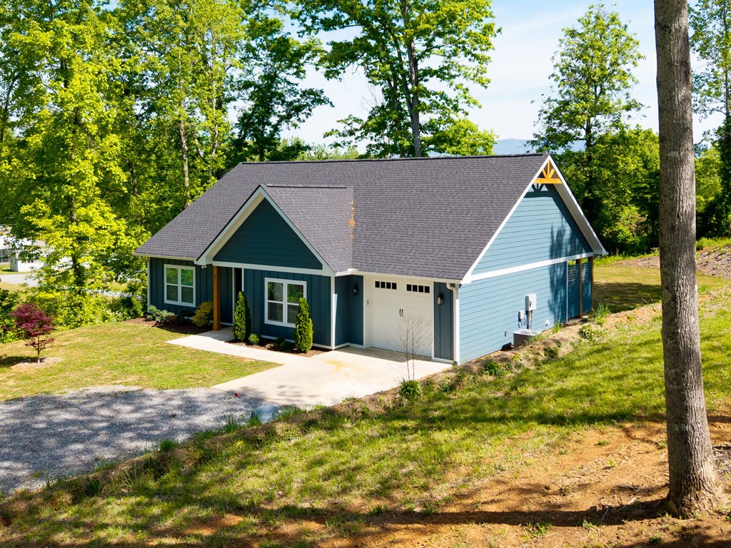 91 Dewey Ridge Lane Hayesville, NC 28904 - Photo 4 of 40 a front view of a house with a yard