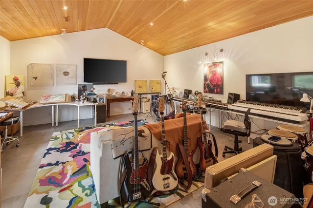 a very nice looking living room with a flat screen tv and furniture