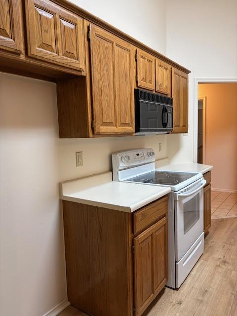 411 Fitch Street Kerrville, TX 78028 - Photo 14 of 33 a kitchen with stainless steel appliances granite countertop a sink stove and microwave