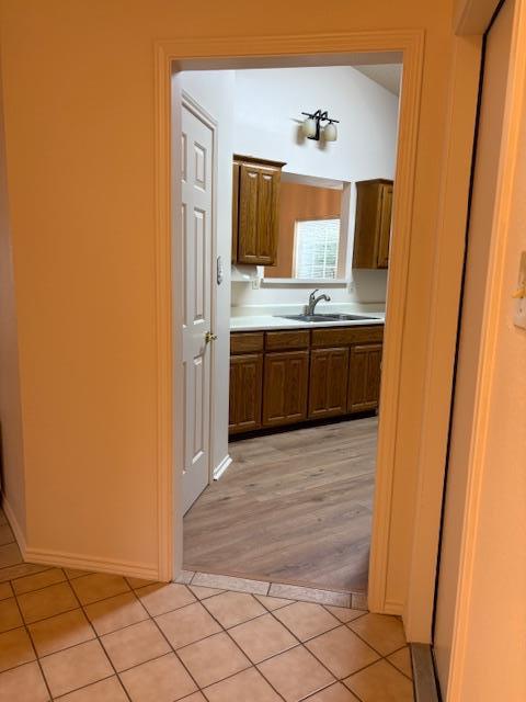 411 Fitch Street Kerrville, TX 78028 - Photo 15 of 33 a bathroom with a granite countertop sink and a mirror