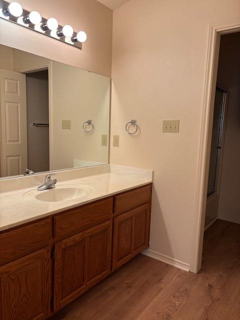 411 Fitch Street Kerrville, TX 78028 - Photo 21 of 33 a bathroom with a double vanity sink and mirror