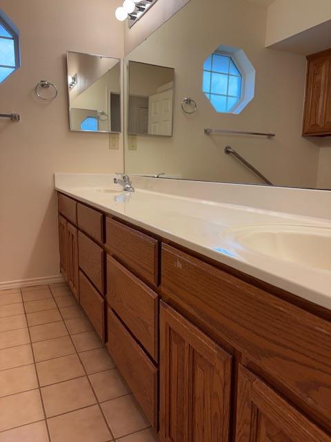 411 Fitch Street Kerrville, TX 78028 - Photo 26 of 33 a bathroom with a sink a mirror and vanity