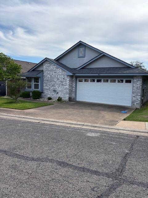411 Fitch Street Kerrville, TX 78028 - Photo 31 of 33 a front view of a house with a yard