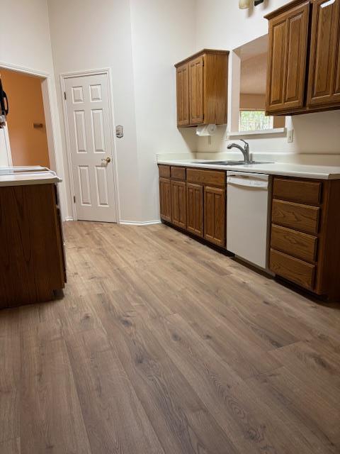 411 Fitch Street Kerrville, TX 78028 - Photo 7 of 33 a kitchen with stainless steel appliances granite countertop a sink and cabinets with wooden floor
