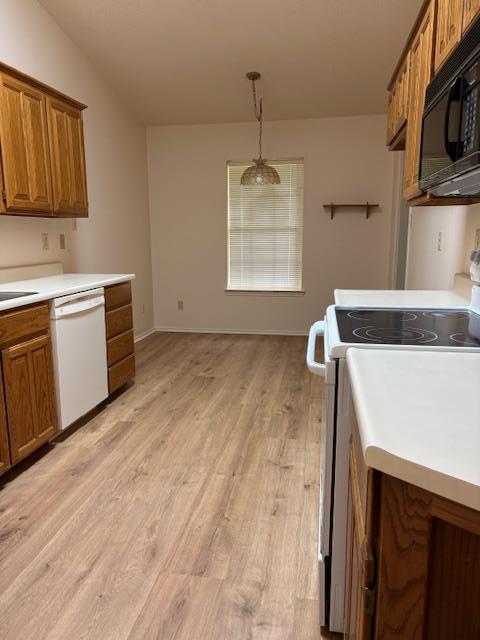 411 Fitch Street Kerrville, TX 78028 - Photo 8 of 33 a kitchen with a sink stove and microwave
