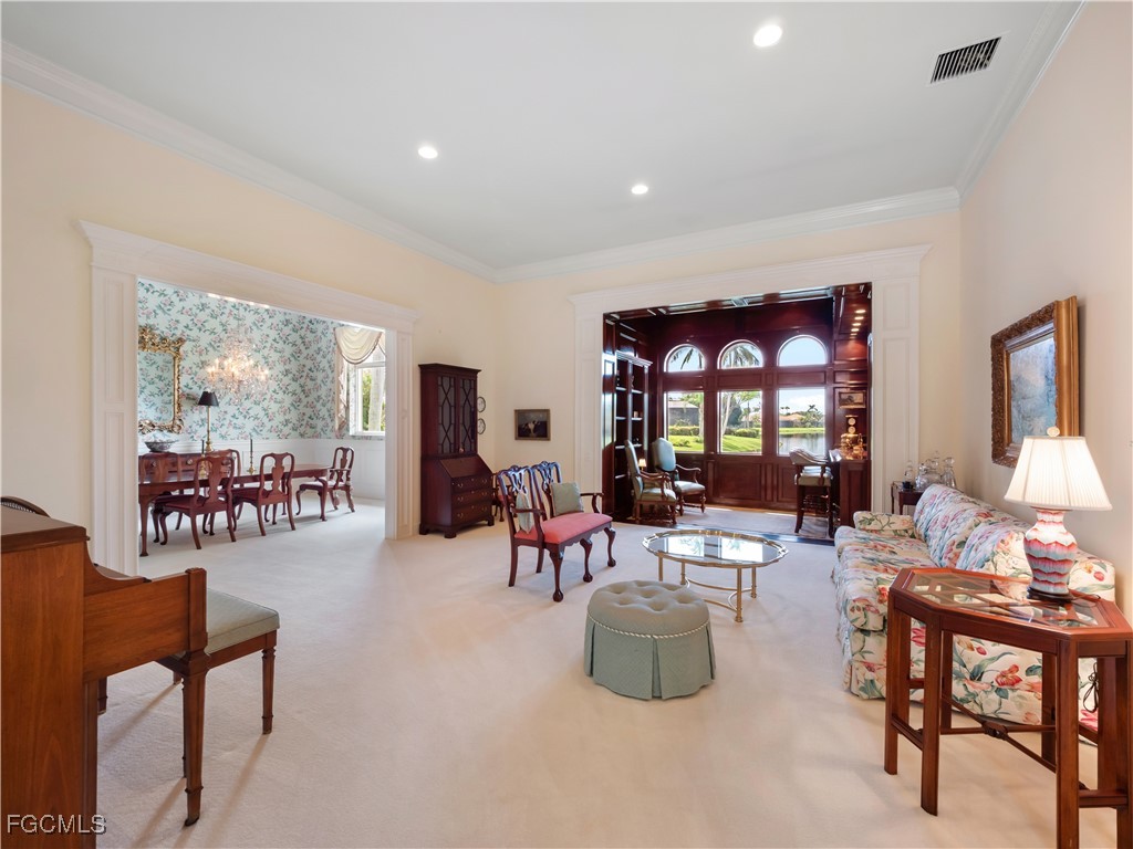 11511 Compass Point Drive Fort Myers, FL 33908 - Photo 16 of 46 a living room with furniture and a large window