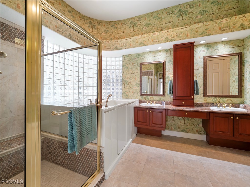 11511 Compass Point Drive Fort Myers, FL 33908 - Photo 26 of 46 a large bathroom with a large tub and sink