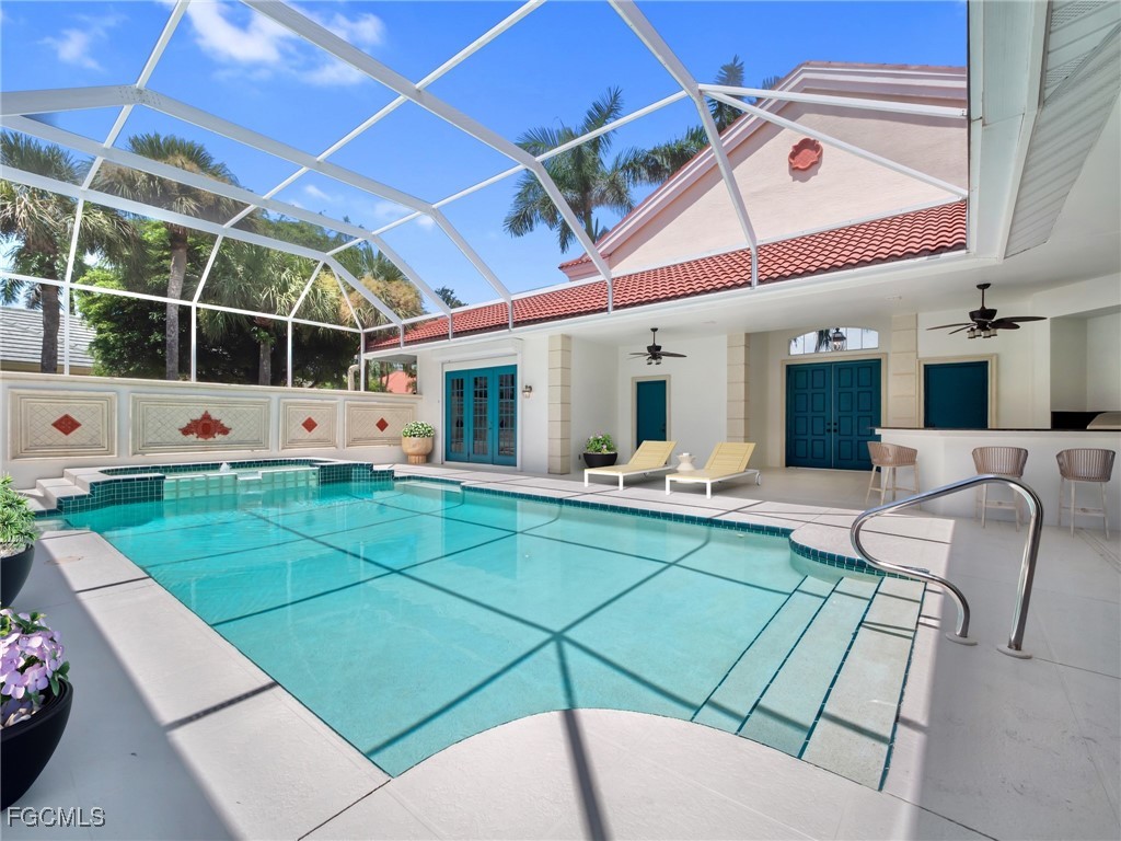 11511 Compass Point Drive Fort Myers, FL 33908 - Photo 29 of 46 a view of a patio with a table and chairs
