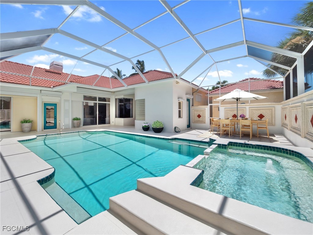 11511 Compass Point Drive Fort Myers, FL 33908 - Photo 31 of 46 a view of a house with a patio