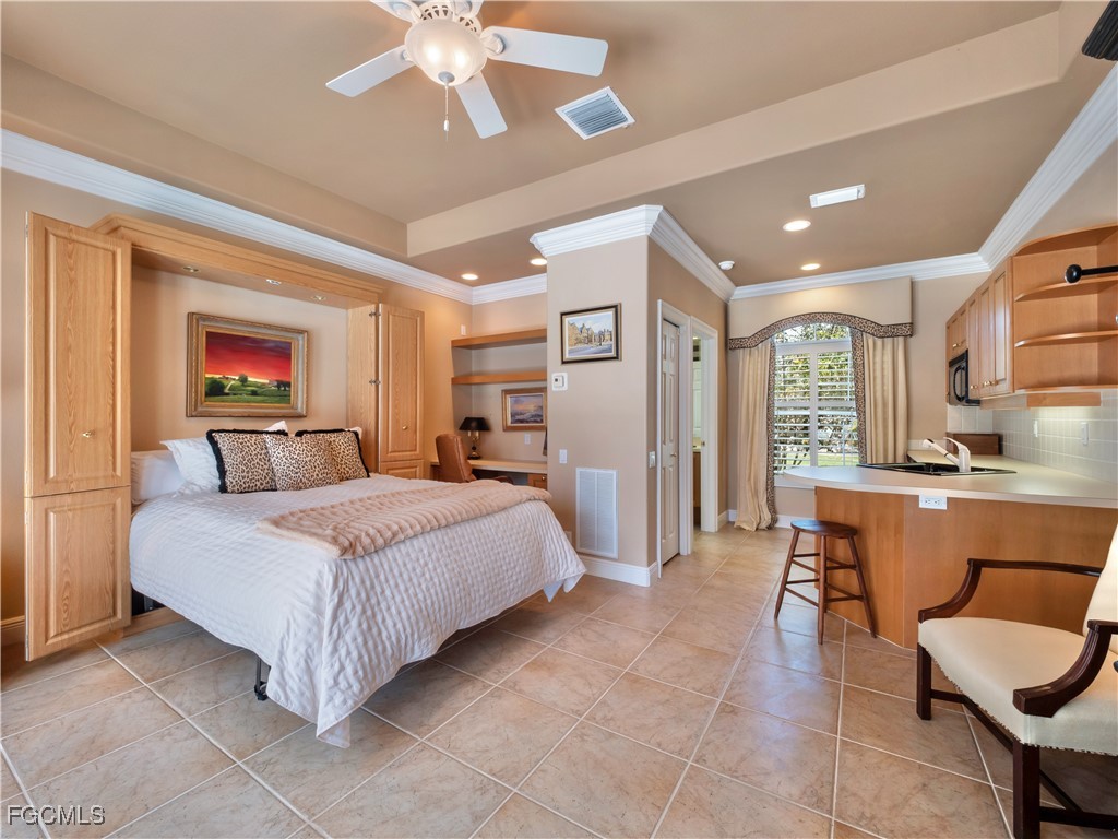 11511 Compass Point Drive Fort Myers, FL 33908 - Photo 34 of 46 a bedroom with a bed and furniture